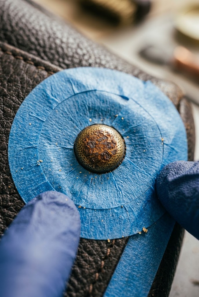 Double-layer tape isolation technique for how to clean rust off handbag rivets